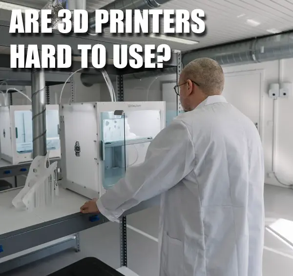 professional in labcoat operating a desktop 3d printer